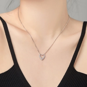 S925 sterling silver heart necklace for women with sparkling cubic zirconia on model