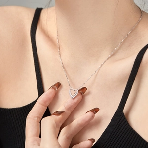 Luxurious S925 sterling silver heart pendant necklace with zircon inlay on female model