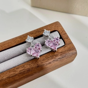 Elegant S925 sterling silver heart earrings with pink zircon stones in a wooden display box