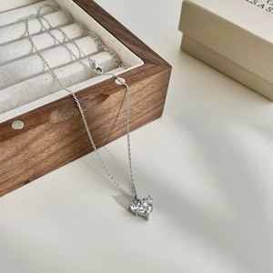 Elegant S925 sterling silver necklace with heart-shaped cubic zirconia on velvet box
