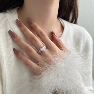 Macro detail of luxury S925 silver ring featuring a pink heart stone and pavé setting