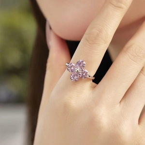 Close-up of S925 sterling silver four-leaf clover ring featuring pink zirconia gemstones