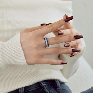 Detail of S925 silver ring featuring blue rectangular zircons and white round stones