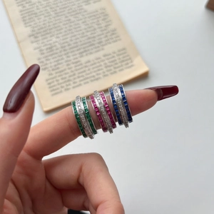 Three S925 sterling silver rings set with emerald, pink, and blue zircon gemstones