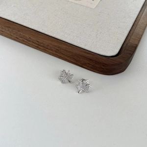 Detailed view of S925 silver maple leaf earrings with sparkling zircon inlay design
