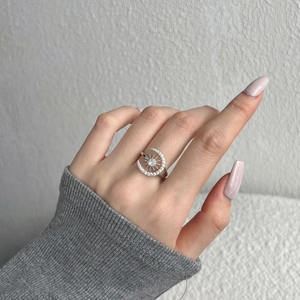 Close-up of S925 sterling silver ring with moon and sun zircon stones on model finger