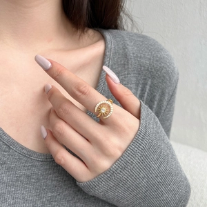Detail of adjustable S925 silver sun and moon ring with sparkling zircon inlay on model finger