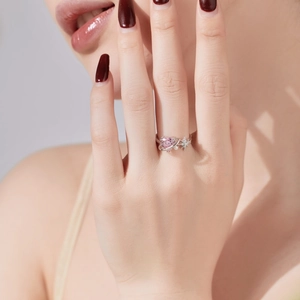 Detail of S925 silver ring featuring pink heart crystal, white pearl and star accent