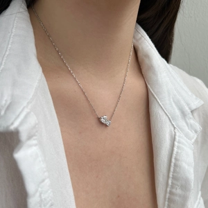 S925 sterling silver bow pendant necklace with sparkling zircons worn by model