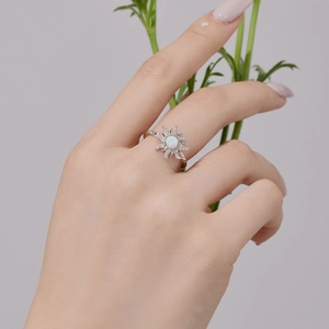 Elegant S925 sterling silver sun opal ring with zircon accents on a model hand
