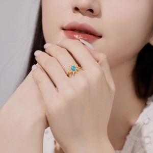 Detailed close-up of S925 sterling silver ring with blue opal and sunburst zircons