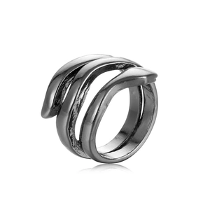 Detail of multi-layer wrap ring in dark gunmetal finish with minimalist snake-like design