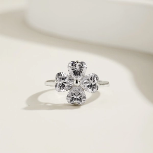 Macro detail of S925 sterling silver ring with heart-cut clover cubic zirconia