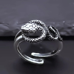 Vintage oxidized silver snake wrap ring featuring detailed scales and open adjustable band