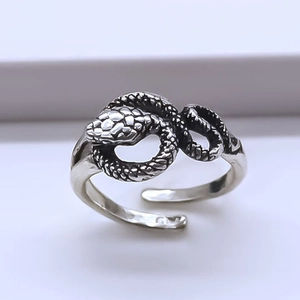 Vintage oxidized silver snake wrap ring featuring detailed scale texture and adjustable design