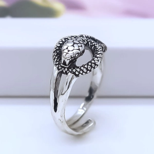 Macro shot of retro silver snake ring showing detailed scales and vintage oxidized finish