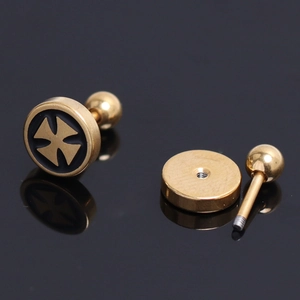 Close-up of gold stainless steel barbell earring with black enamel cross and screw back