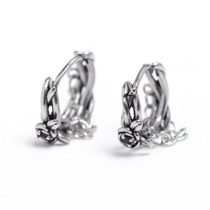 Vintage oxidized silver hoop earrings featuring rose flower design and black crystals