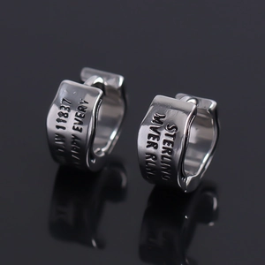 Vintage wide wavy stainless steel hoop earrings with engraved text on mirror surface