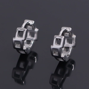 Elegant geometric silver hoop earrings with hollow square links on black mirror background