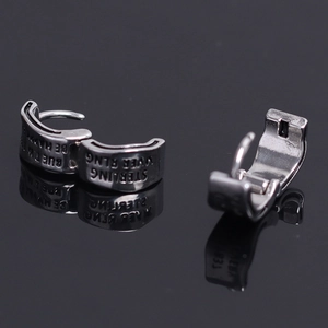 Polished sterling silver hoop earrings with embossed Be Happy and Sterling Silver text