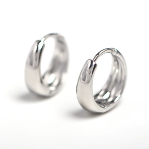 Minimalist silver hoop earrings for men with a polished mirror finish on white background