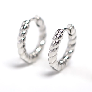 Elegant silver twisted rope hoop earrings with a polished minimalist design on white backdrop