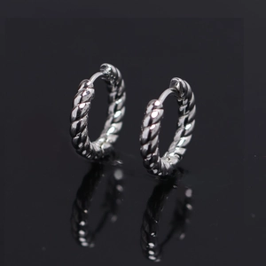 Minimalist silver twisted hoop earrings with a polished metallic rope texture for women