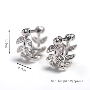 Elegant silver leaf stud earrings with crystal zirconia details on white background