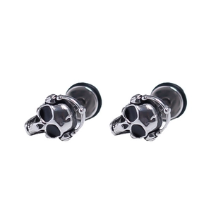 Punk style stainless steel skull stud earrings with polished finish on white background