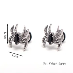 Gothic silver spider stud earrings with black gemstone in a balanced symmetrical view