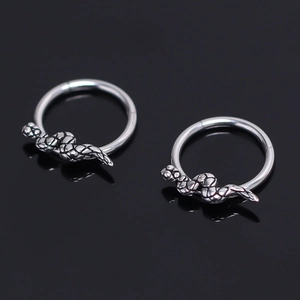 Retro stainless steel snake hoop earrings with detailed scale engraving on black surface