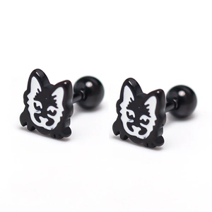 Macro shot of black and white enamel husky stud earrings with barbell screw backs
