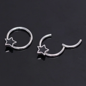 Surgical steel star hoop earrings with black enamel inlay and clicker hinge closure