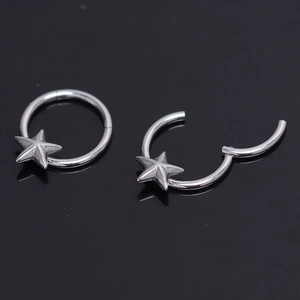 Pair of silver star hoop earrings in stainless steel with a secure snap closure