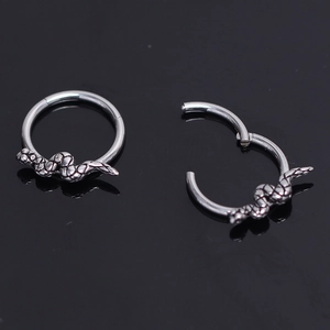 Pair of stainless steel snake hoop earrings showing hinged closure and open structure