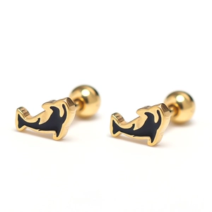 Detailed macro view of golden dolphin stud earrings with black enamel and screw ball back