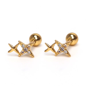 Detailed macro view of gold star cartilage studs with sparkling zircon pavé and screw back