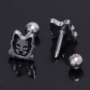 Detail view of silver tiger face stud earring with screw ball back and metal texture