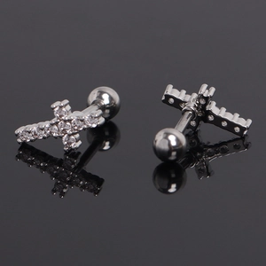 Detailed view of silver cross stud earrings with sparkling zircon stones and screw backs