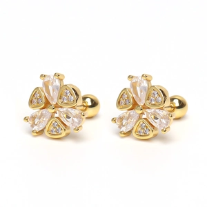 Detail of flower stud earrings featuring clear zircon petals and gold screw back closures