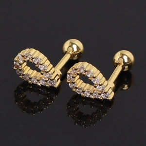 Close-up of heart-shaped gold stud earrings with pavé set cubic zirconia and screw back