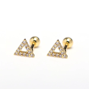 Macro shot of triangle stud earrings with gold plating and cubic zirconia stone accents