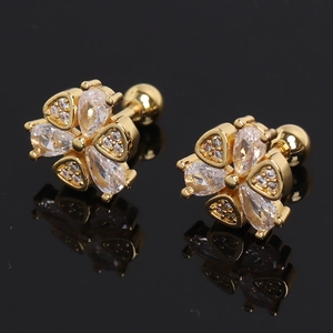 Elegant gold flower stud earrings with sparkling zircon petals on a black reflective surface