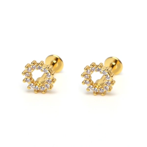 Macro view of gear-shaped gold earrings with white zircon pavé and screw back detail