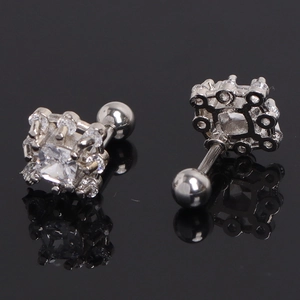 Macro detail of silver square cubic zirconia stud earrings with screw ball backs