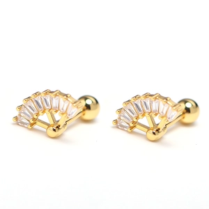 Macro shot of fan-shaped gold earrings with rectangular cubic zirconia and ball back studs