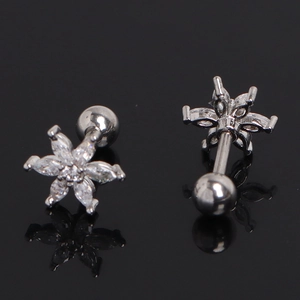 Detailed view of silver flower cartilage stud with white zircon and screw ball back