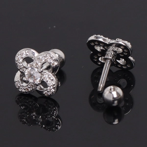 Detailed view of silver flower earrings with zircon pavé and screw-back ball closure