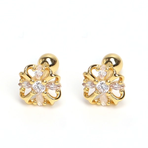 Detail of flower-shaped stud earrings with gold plating and clear zircon crystals